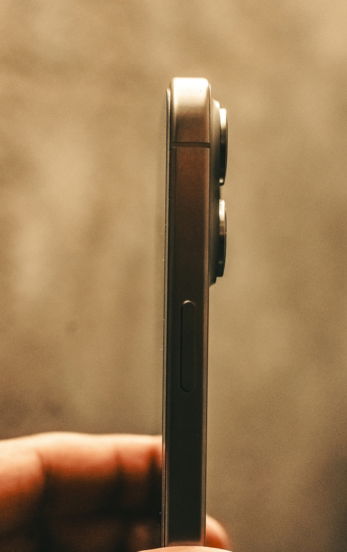 a close up of a person holding a cell phone