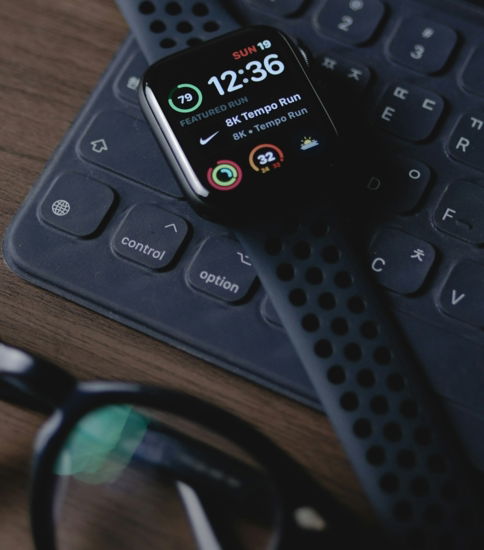 black smart watch on black computer keyboard